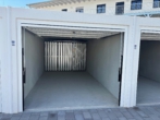 Garage - Ihr neues Zuhause: Exklusive 3-Zimmer-Neubauwohnung zum Erstbezug mit Gartenanteil