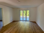 Wohnzimmer - Ihr neues Zuhause: Exklusive 3-Zimmer-Neubauwohnung zum Erstbezug mit Gartenanteil