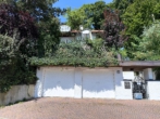 Garage (Linke Seite) - Charmante 2-Zimmer-Wohnung mit Wintergarten, großem Garten & Garage in gehobener Lage Landshuts!