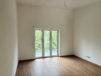 Wohnzimmer - 3-Zimmer-Neubauwohnung zum Erstbezug mit Garage, Balkon und Aufzug