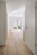 Wohnbereich - Zentrale 2-Zimmer-Neubauwohnung mit Terrasse und Gartenanteil!