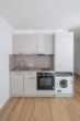 Küche - Zentrale 2-Zimmer-Neubauwohnung mit Terrasse und Gartenanteil!