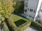 Außenansicht Luftbild - Modernisiertes Wohnglück mit großzügigem Privatgarten – attraktive 3-Zimmer-Wohnung